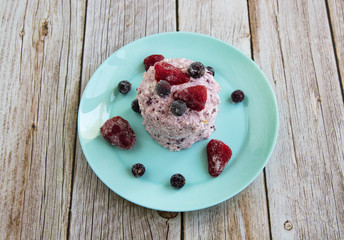 Carrot cake with curd cream, strawberries and currants