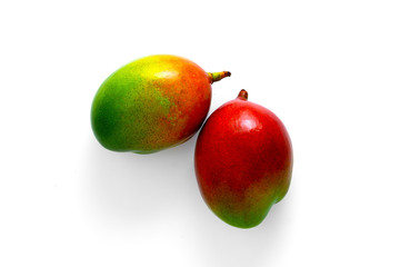 Fresh whole mango fruits on white background, top view.