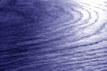 Wooden board texture with blur effect in blue tone.