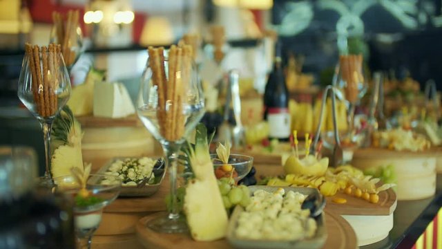 Desserts lined up on a table waiting to be served inside a fancy restaurant. open buffet at the hotel