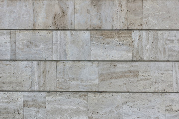 Marble beige tile wall covering. Building facade. Marble background texture