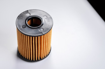 The filter element of a new oil filter. New spare parts for an internal combustion engine. Filter insert