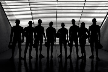 a team of pilots in a wind tunnel hangar