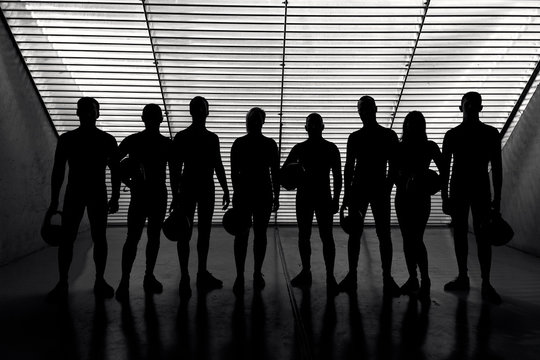 a team of pilots in a wind tunnel hangar