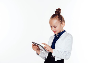 little girl looks at business Lady tablet computer