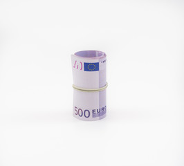 Banknotes five hundred and 500 euros in a roll with an elastic band. European currency to save. Close-up, white background. The concept of the safety of deposits and money.