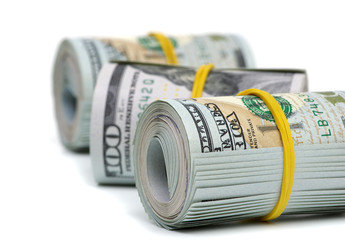 Hundred dollar bills rolled up with rubberband
