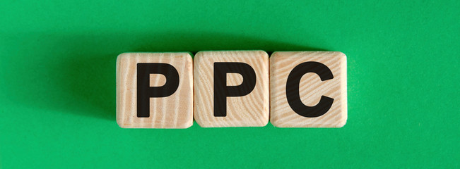 PPC - text on wooden cubes with green background