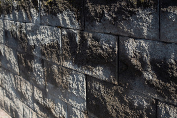 High resolution black seamless brick wall texture pattern background. Seamless worn style burned style brick wall background. Black grey brick wall pattern worn texture. Worn style seamless brick wall