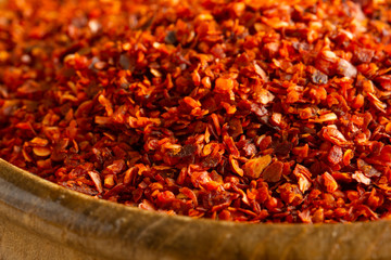 Spices: Dried ground red pepper in bowl.