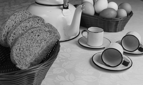 A table arrangement with, teapot, breads and cookies