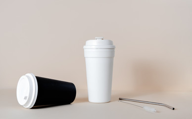 Reusable coffee cup with iron straw and a brush. Zero waste concept horizontal view copy space