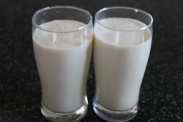 Two glass of apple juice.