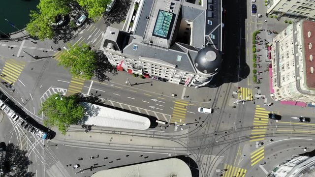 Zuerich Switzerland Drone Aerial Top View of Bellevue Tram Station with Tram Traffic - Slowly Moving Up
