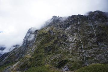 Stripes of water coming down on the mountain side