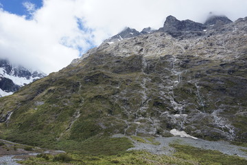 Stripes of water coming down on the mountain side