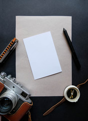 Top view hipster vintage mock up with heritage with old camera, pen,harmonica, ,space for text. Branding template, travel mockup with vintage background. Travel /explorer mock up, adventure mock-up.