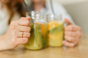 Fototapeta premium Couple drinking smoothies in a cafe