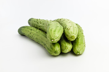 Elongated raw cucumber with background