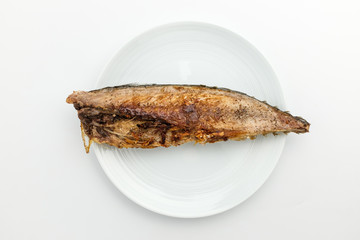 Grilled mackerel fish on background