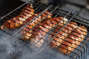 Grilled sausages, cooked on the grill. Barbecue. Still life.
