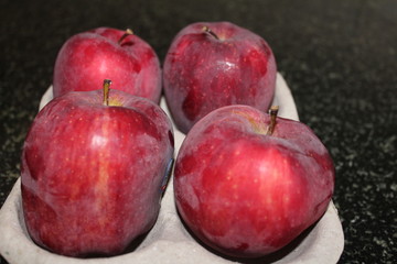 Set of fresh apples on a bowl.