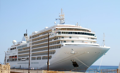 Big white cruise ship in port at sea