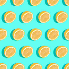 Lemon citrus fruits seamless pattern on green turquoise minimal background, tropical fresh juicy slices