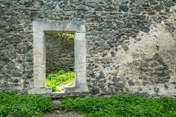 the ruins of an old castle overgrown with grass. Nevytskyi castle Uzhhorod.