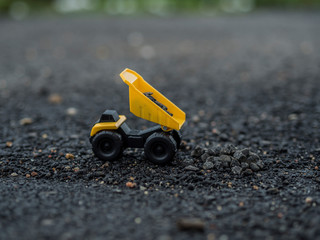Toy construction machinery working on an excavation © by Jose Marcos