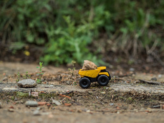 Toy construction machinery working on an excavation