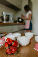 Delicious strawberry blueberry pie, tart with pudding with kitchen background