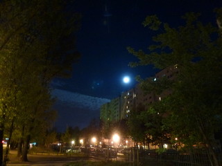 Fototapeta na wymiar Full moon in the city at night