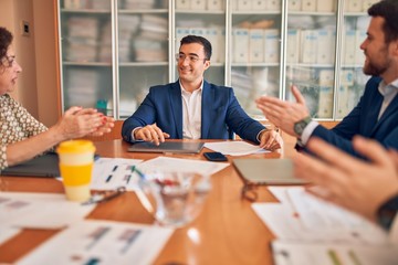 Business lawyers workers meeting at law firm office. Professional executive partners working on finance strategry at the workplace. Clapping to each other for successful achievement.