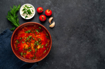 Borsch - Traditional Ukrainian dish in a plate on a stone background with copy space for your text