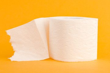 Toilet paper roll on a yellow background.
