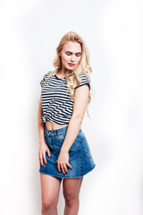 Fototapeta premium young pretty teenage hipster girl posing emotional happy smiling on white background, lifestyle people concept
