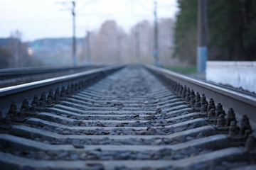 rails and sleepers and stones, railway tracks go into the distance