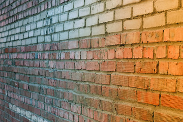 Perspective iew on the facade of the old brick wall