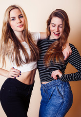 best friends teenage girls together having fun, posing emotional on white background, besties happy smiling, lifestyle people concept closeup. making selfie