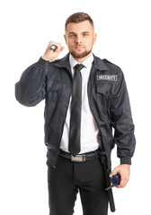 Male security guard with flashlight on white background