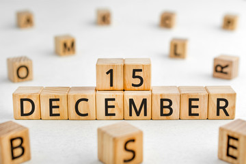 December 15 - from wooden blocks with letters, important date concept, white background random letters around