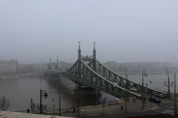 bridge in the fog over Danube river in Budapest 