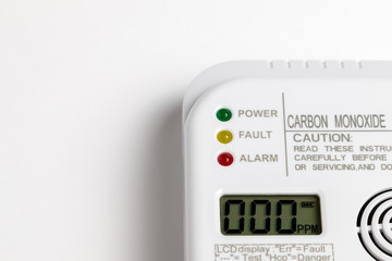 Carbon monoxide detector on a white wall. Stay home safe. Home control and security.  CO detector