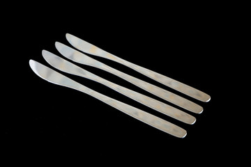 Metal knives on a black background. Suitable for mockups. Kitchen appliances. Knives for cooking food