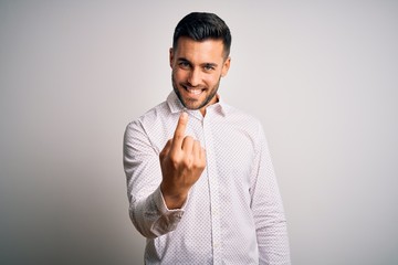 Young handsome man wearing elegant shirt standing over isolated white background Beckoning come here gesture with hand inviting welcoming happy and smiling