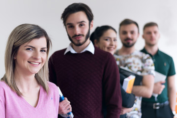 Lifestyle, education and people concept, Group of Young multiethnic university students standing inside classroom and looking at camera.