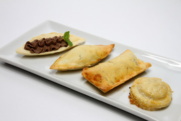 Four different types of rustico, traditional pastry from Lecce, Italy. Finger food