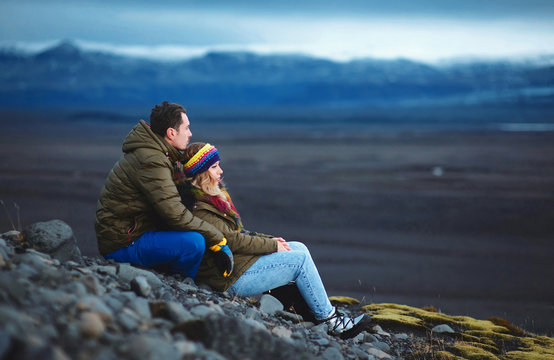 couple sitting together and enoying mountain view