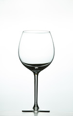 Empty wine glass on a white background